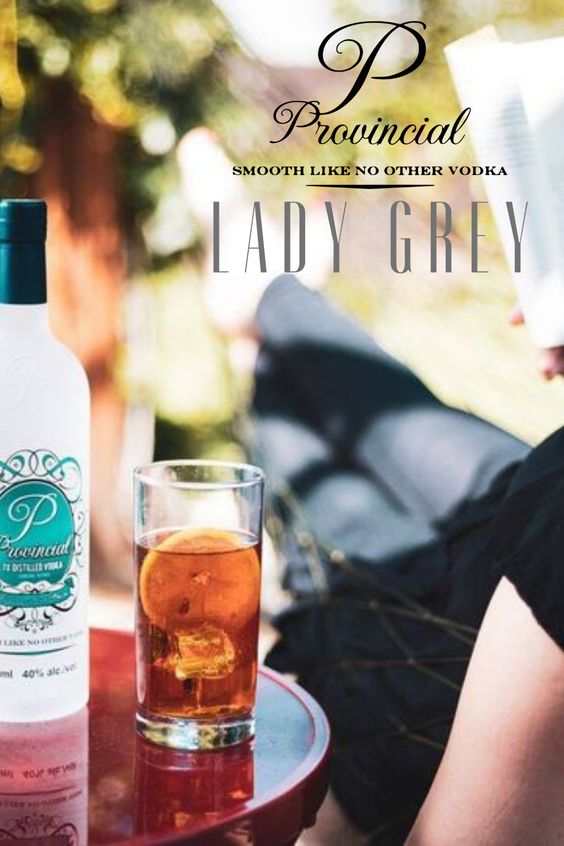 Glass of vodka served on the table 