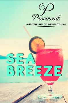 Glass of Vodka served on the beach sand